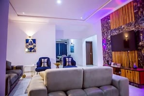 Deluxe Room, Balcony, City View | Living area - TAJ SUITES  (Ado Ekiti)