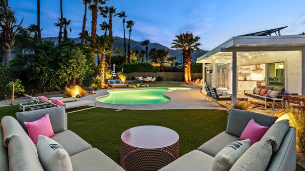 A modern outdoor living area with a pool, seating, and a covered patio. - Kaptur Palms (Palm Springs)