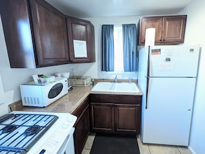 Fridge, microwave, stovetop, coffee/tea maker