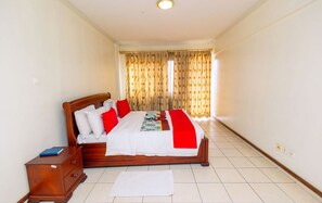 In-room safe, desk, laptop workspace, blackout curtains - Altis Apartments (Kigali)