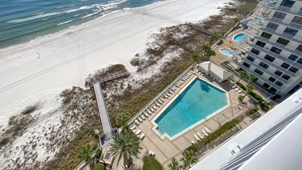 A resort with a pool, beach, and ocean view. - Pelican Pointe 1203 (Orange Beach)