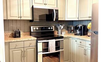 Coffee/tea maker, fridge, microwave, oven
