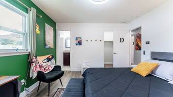 Family House | Desk, laptop workspace, blackout drapes, iron/ironing board