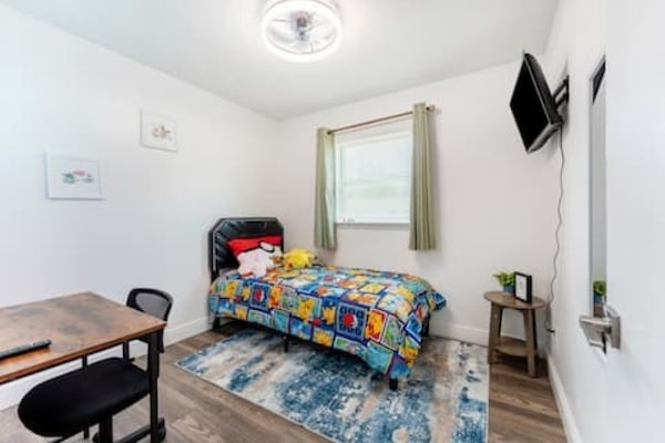 Family House | Desk, laptop workspace, blackout drapes, iron/ironing board