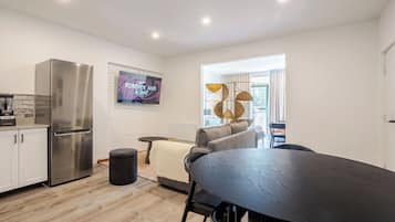 Deluxe Apartment, 1 Queen Bed | Living area | 32-inch Smart TV with digital channels