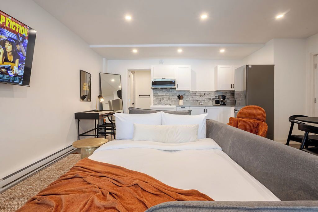 Deluxe Apartment, 2 Bedrooms | Living area | 32-inch Smart TV with digital channels