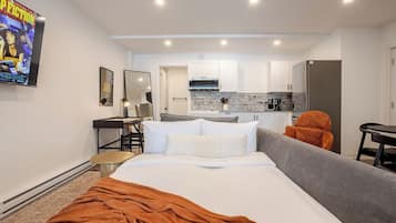 Deluxe Apartment, 2 Bedrooms | Living area | 32-inch Smart TV with digital channels