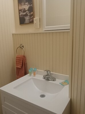 Shower, towels, soap, toilet paper