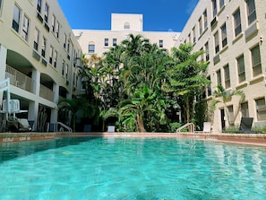 Outdoor pool, open 7:00 AM to 7:00 PM, sun loungers