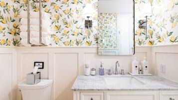 Shower, eco-friendly toiletries, hair dryer, towels