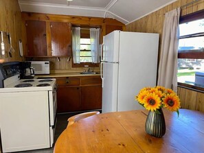 Fridge, microwave, stovetop, cookware/dishes/utensils