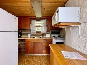 Fridge, microwave, stovetop, cookware/dishes/utensils