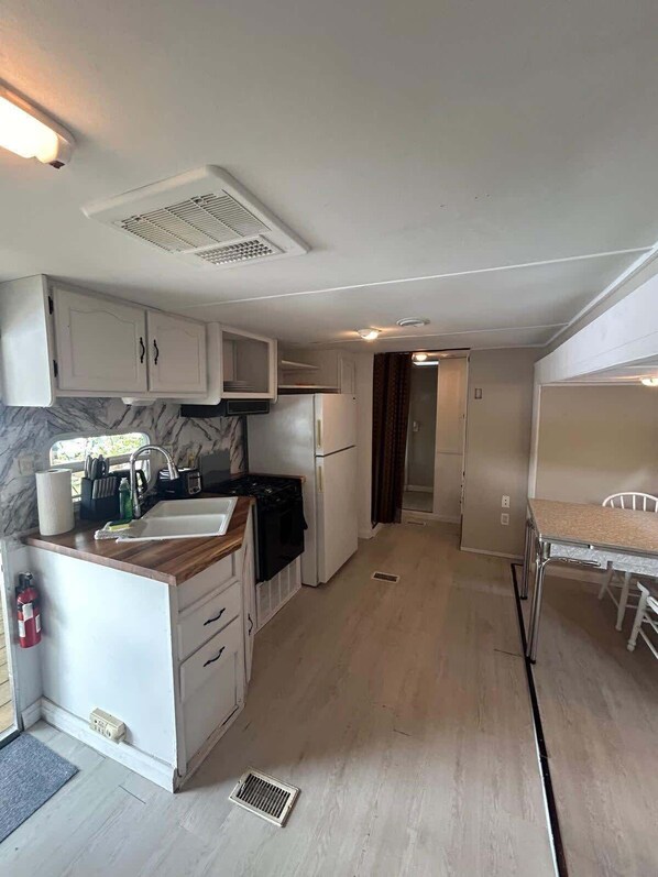 Fridge, microwave, cookware/dishes/utensils