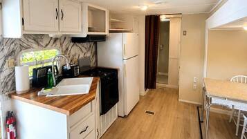 Fridge, microwave, cookware/dishes/utensils