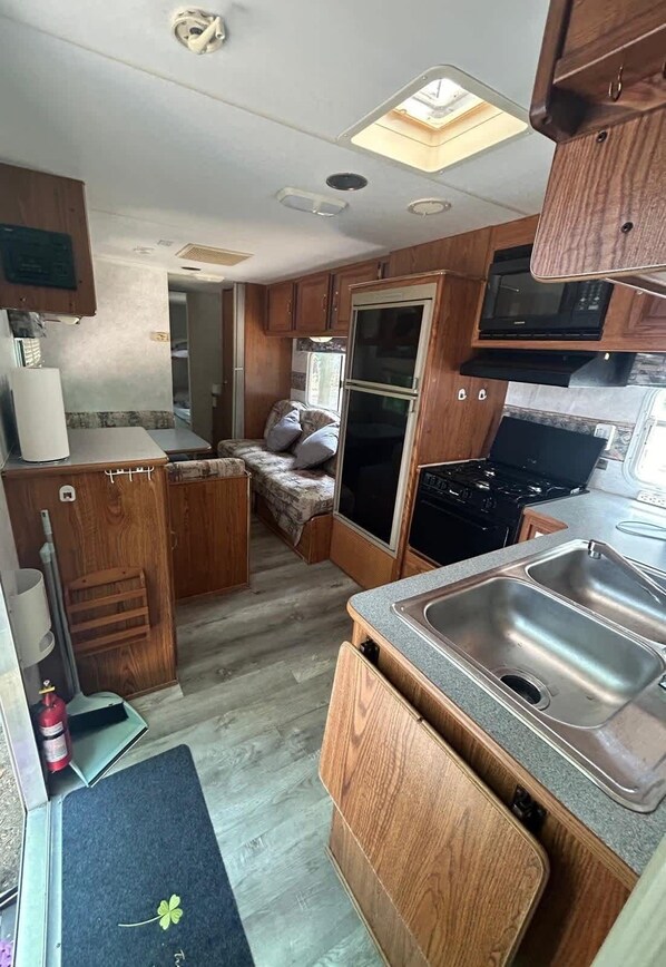 Fridge, microwave, cookware/dishes/utensils