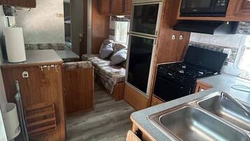 Fridge, microwave, cookware/dishes/utensils