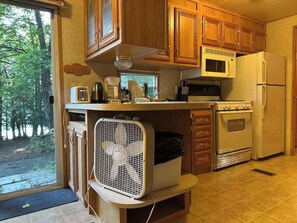 Fridge, microwave, cookware/dishes/utensils