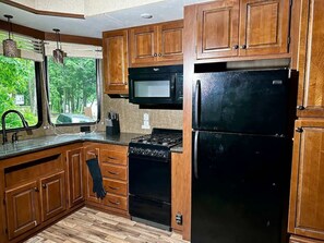 Fridge, microwave, cookware/dishes/utensils