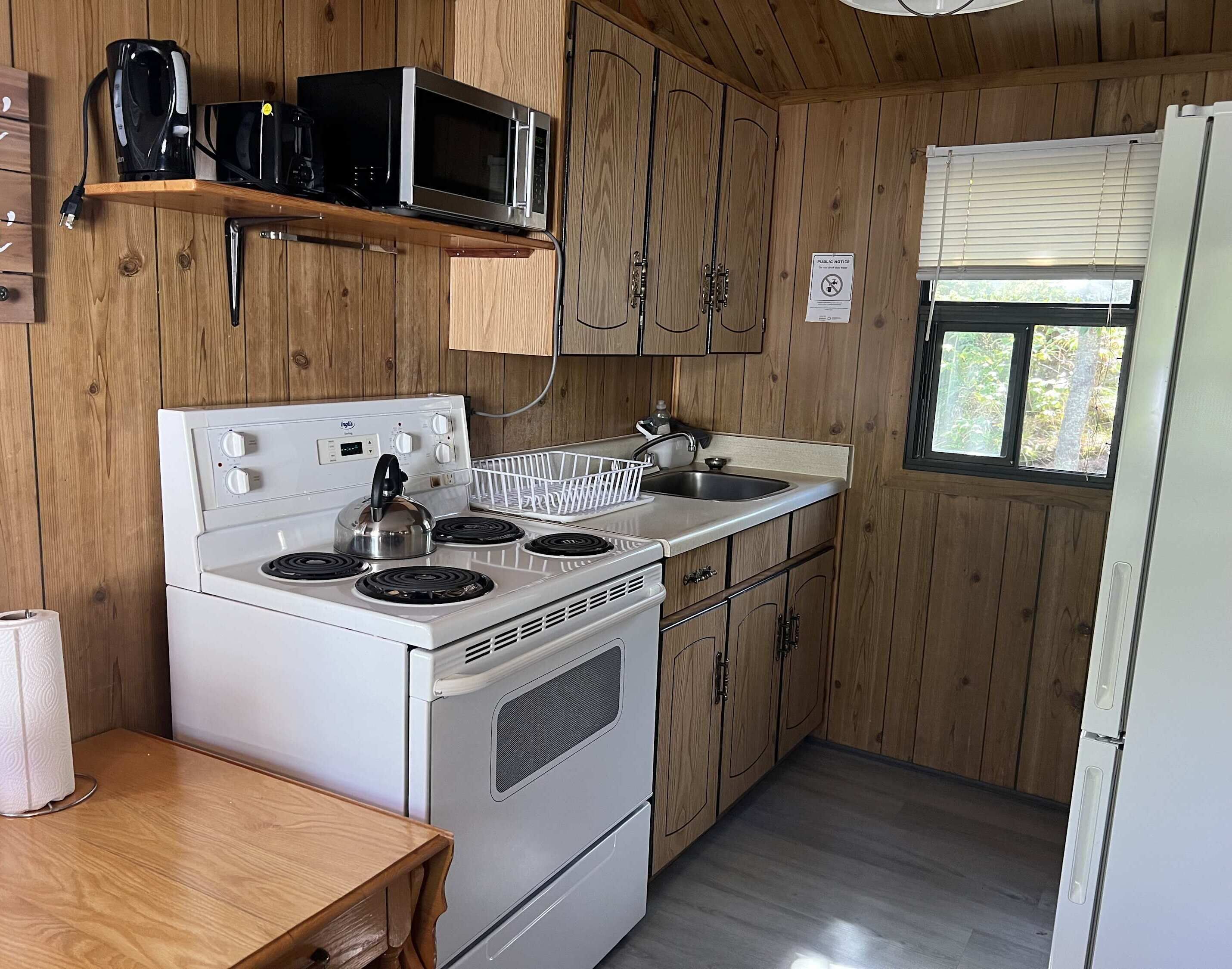 Fridge, microwave, stovetop, cookware/dishes/utensils