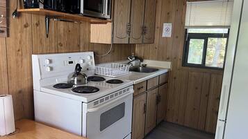 Fridge, microwave, stovetop, cookware/dishes/utensils