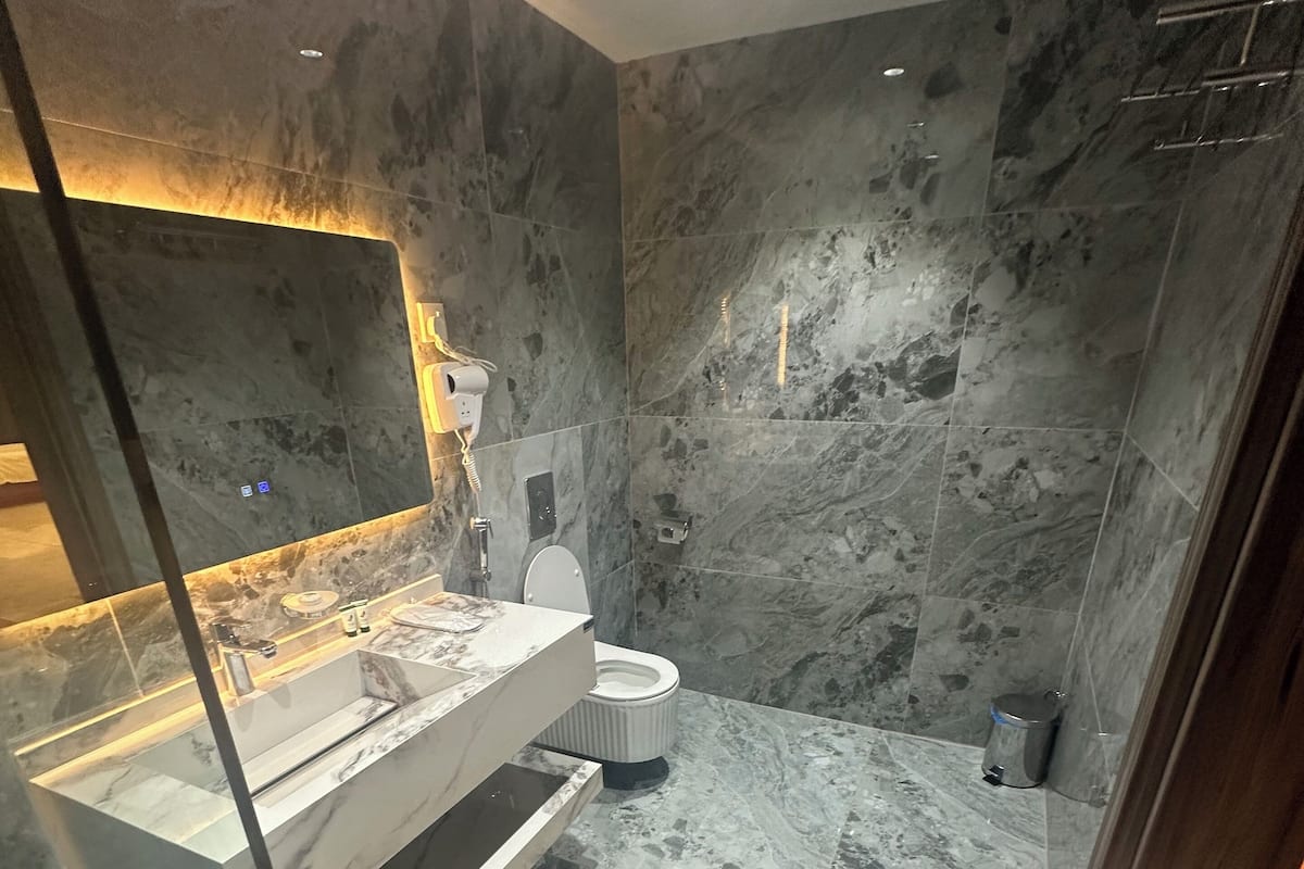 Shower, free toiletries, hair dryer, slippers