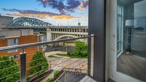 A balcony with a view of a bridge and buildings. - City-view, Free Parking, 24/7 Gym (Cleveland)