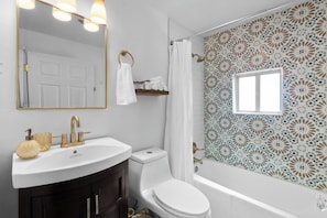 Hair dryer, towels, soap, toilet paper