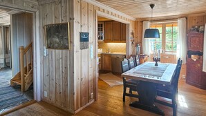 A wooden interior with a dining area, kitchen, and a staircase. - Awesome home in Eggedal with sauna (Eggedal)