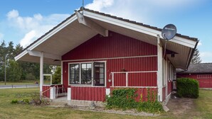 A red building with a white roof and a satellite dish. - Awesome home in Everöd with WiFi (Everöd)