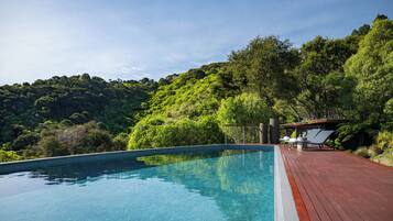 Seasonal outdoor pool, pool umbrellas, pool loungers