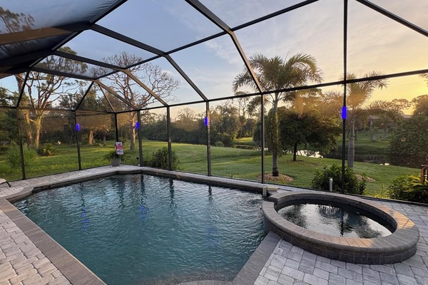 Sparkling pool & spa overlooking canal. Pool size: 22' x 14' x 6'. Spa seats 6