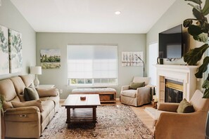TV, fireplace, books, offices
