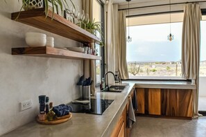 Fridge, stovetop, coffee/tea maker, cookware/dishes/utensils