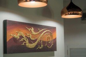 A wall with a framed artwork depicting a dragon design. - Spacious 8Br Private Pool Villa in Chalong (Phuket)