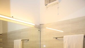 A modern bathroom with a rectangular sink, a mirror, a towel rack, and a toilet. - Travel Lodge Islamabad F-8 (Islamabad)