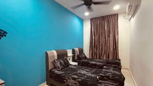 A bedroom with a bed, a ceiling fan, a window with curtains, and an air conditioning unit. - Johor Senai (Senai)
