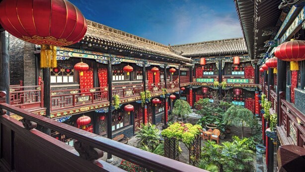 A traditional courtyard with ornate architecture, including tiled roofs and red lanterns. - PingYao ChengJia Laoyuan Hotel (Jinzhong)