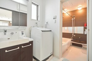Jetted tub, hair dryer, towels, soap