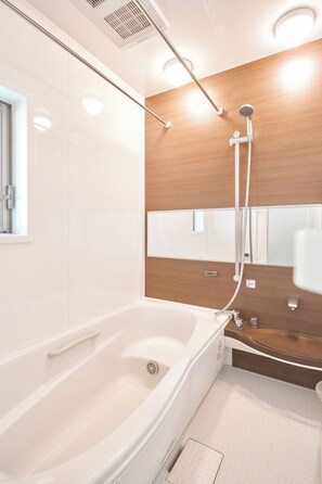 Jetted tub, hair dryer, towels, soap