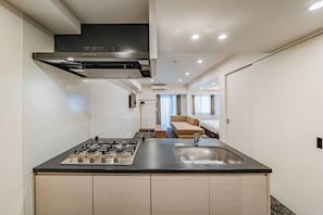 Family Room, Multiple Beds, Non Smoking | Private kitchen | Fridge, microwave, stovetop, cookware/dishes/utensils