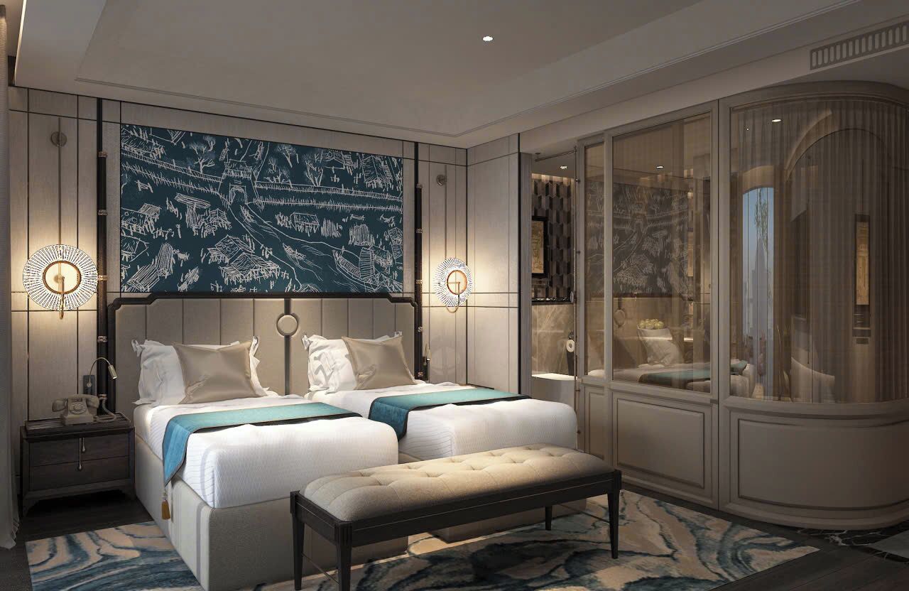Een moderne hotelkamer met een groot bed, nachtlampjes, een bankje en een groot raam met uitzicht.