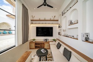 Luxury Villa, Patio, Pool View | Living area | 75-inch flat-screen TV with cable channels - Villa Lumière 1 Seminyak (Seminyak)