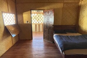 A room with a bed, a window, and a door leading to another room. - Koh Jum Family Homestay (Koh Jum)