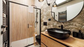 Deluxe Studio, Balcony, City View | Bathroom | Shower, hair dryer, towels, soap