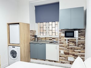 Fridge, microwave, stovetop, coffee/tea maker