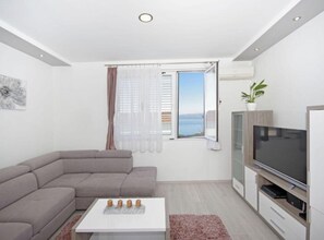 Apartment (Three Bedroom Apartment With Terrace) | Living room | 32-inch flat-screen TV with digital channels