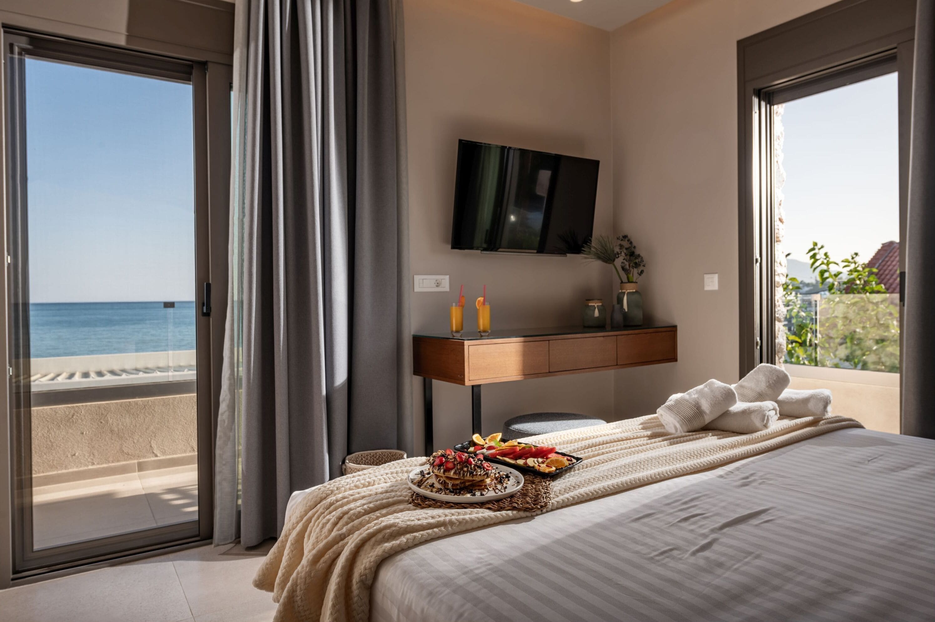 Deluxe Room, Balcony, Beach View | In-room safe, iron/ironing board, free WiFi