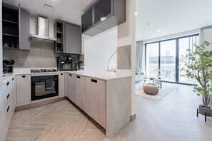 Deluxe Apartment, Balcony, City View | Private kitchen | Espresso maker, electric kettle