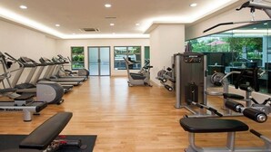 A gym with treadmills, ellipticals, and weight machines. - A Stylish High Floor 3BR Apt at Bukit Bintang (Kuala Lumpur)