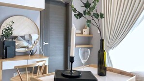 A modern bedroom with a bed, bedside table, and a bedside lamp. - A Lux 2BR Suasana Suites in JB, Free Parking (Johor Bahru)